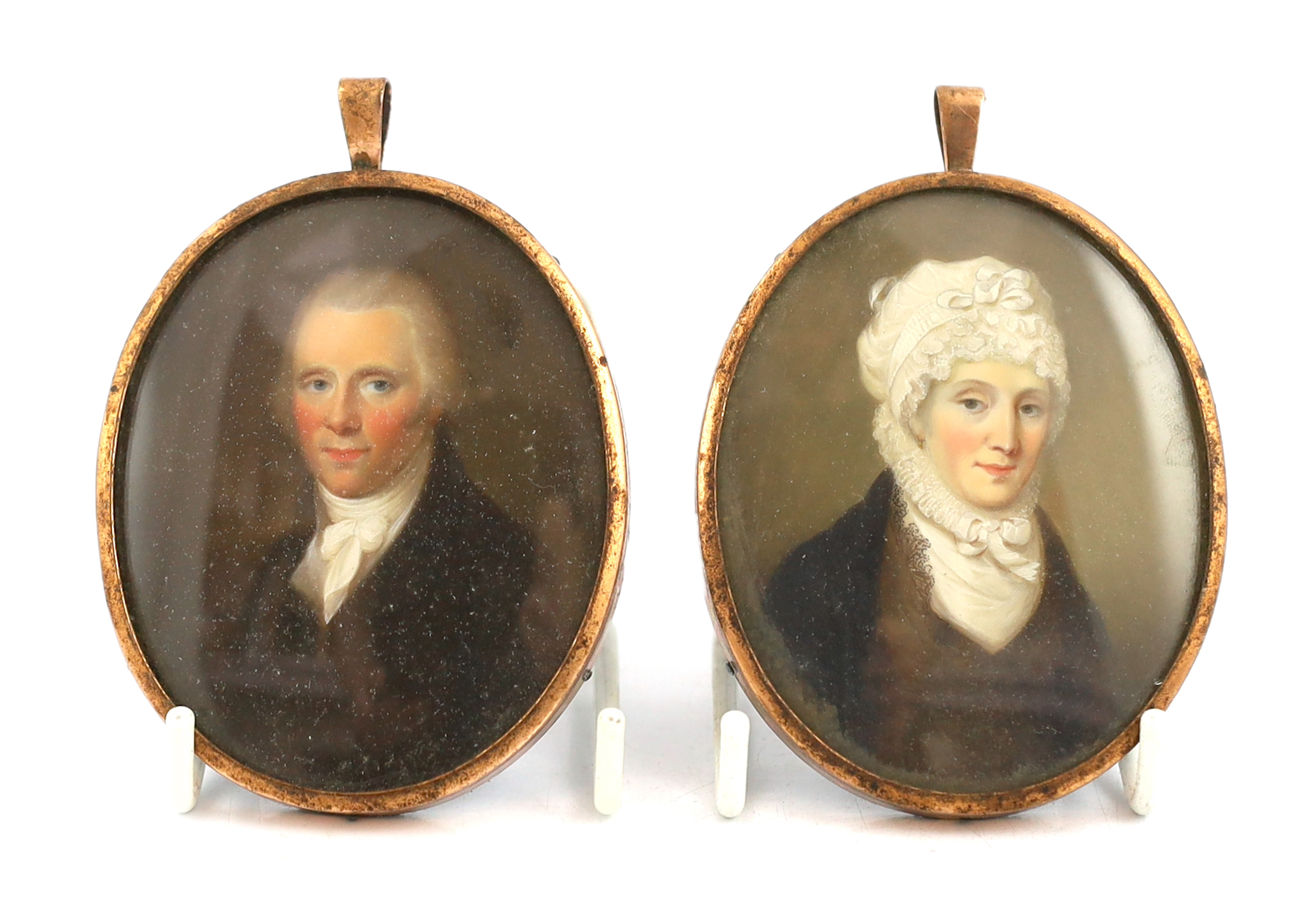 English School circa 1840, Portrait miniatures of a lady and gentleman, watercolours on ivory, a pair, 7.5 x 6.2cm. CITES Submission reference N7NEFL8B